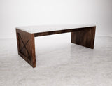 Table with a wooden structure and a marble top.